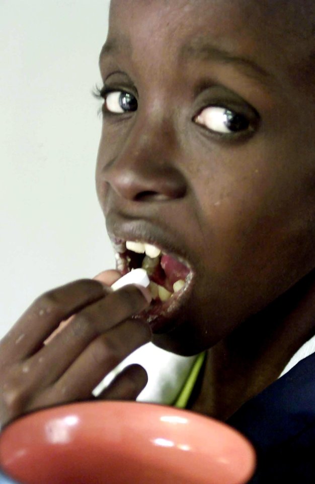  Pictured at the age of 11, Nkosi took a daily cocktail of medicine in Johannesburg, South Africa