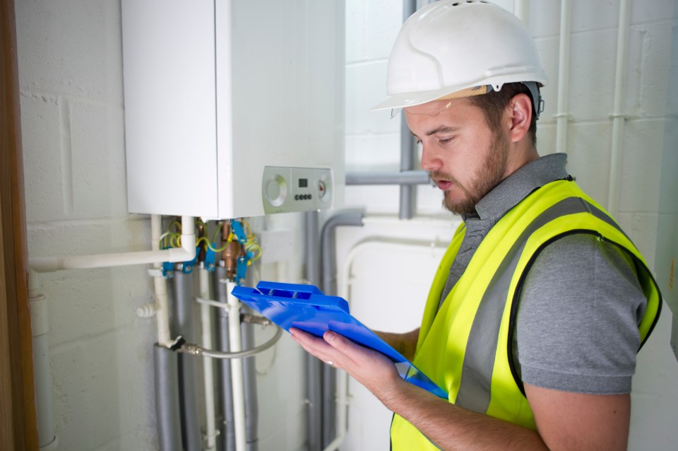 Man checking boiler