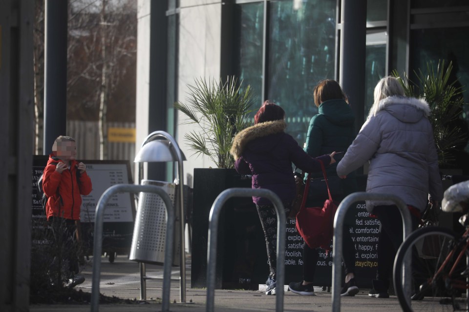 People seen milling about outside the York hotel where two people fell ill