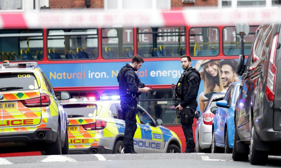  Dozens of police cars seen on the high street where buses and traffic has been stopped