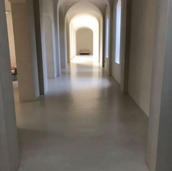  The hallway is particularly empty and contains almost no furniture