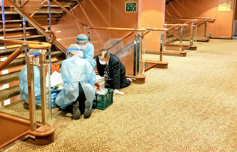  Medics gathering around equipment in a stairway