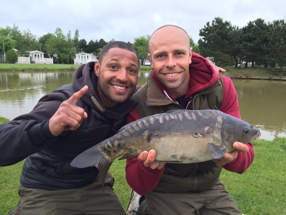 Kell Brook, who is giving up on fighting rival Amir Khan, shows off a fish with athlete pal Dean Macey