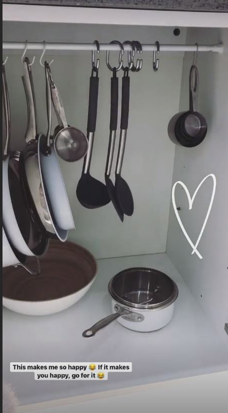 Stacey revealed how she uses cheap curtain hooks on a tension rod to bring order to her cupboards