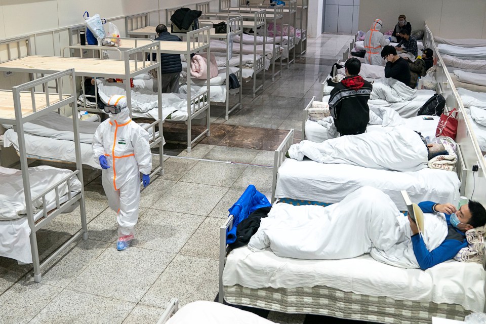  Medical workers in protective suits attend to patients in Wuhan