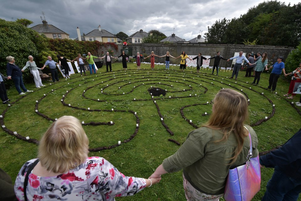  Survivors meet for an emotional vigil at the Tuam institution, where a mass grave was chillingly found