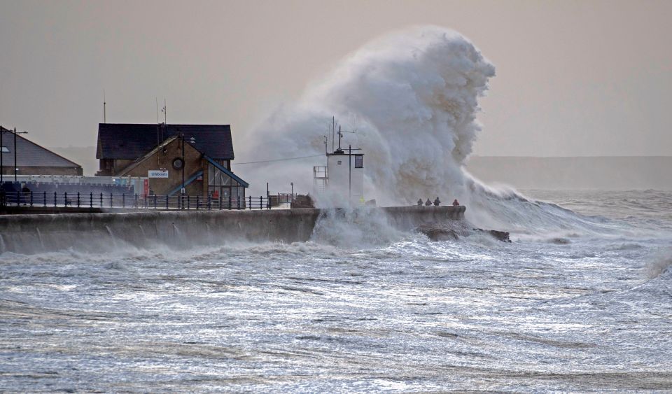  Huge waves crash into the harbour wall this morning at Porthcawl in South Wales