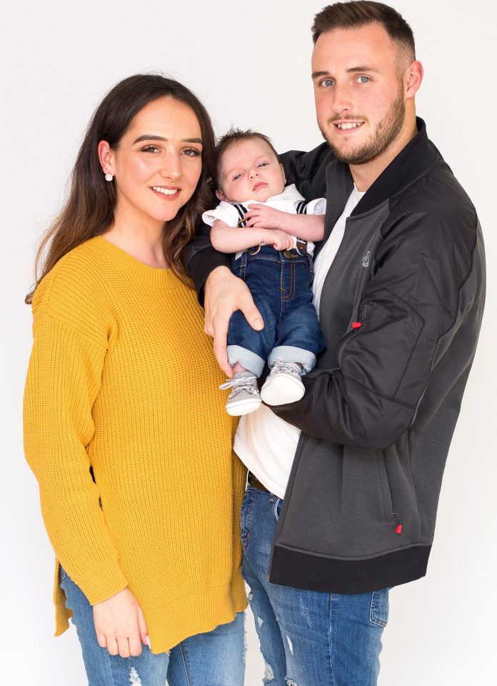  SallyAnn and Ryan are pictured with their little boy Tommy, who recently celebrated his second Christmas