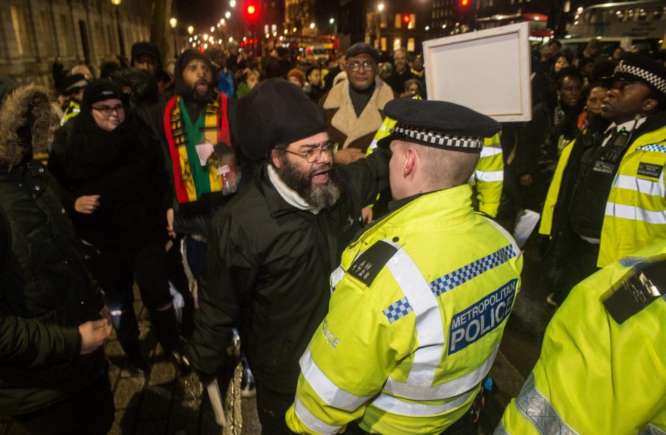  Protesters attend a demonstration outside Downing Street against the deportations to Jamaica