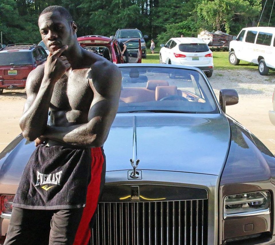 Wilder rests on the bonnet of his Rolls Royce Phantom