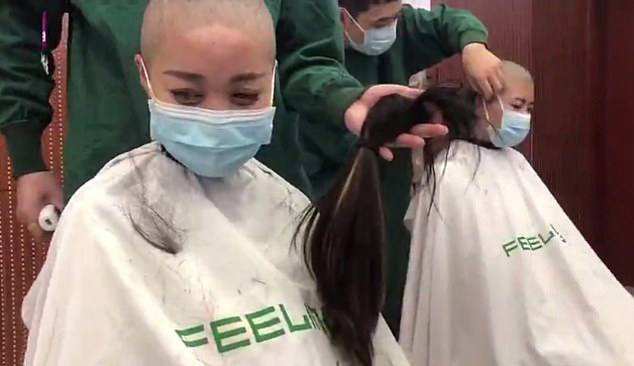  A hospital in China has been accused of forcing its female medics to shave off their hair to show their determination to fight the novel coronavirus