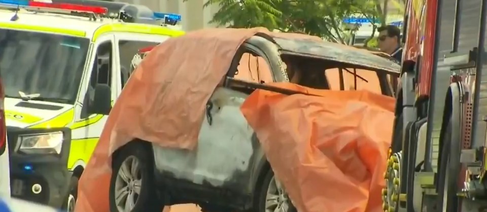  Three children died trapped inside a car that was set alight in Brisbane today