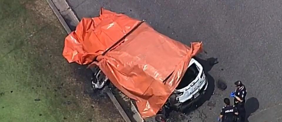  The SUV has been covered by a tarpaulin