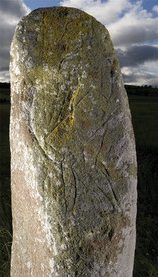  The main side of the Tulloch stone features a carving of a man holding a shield