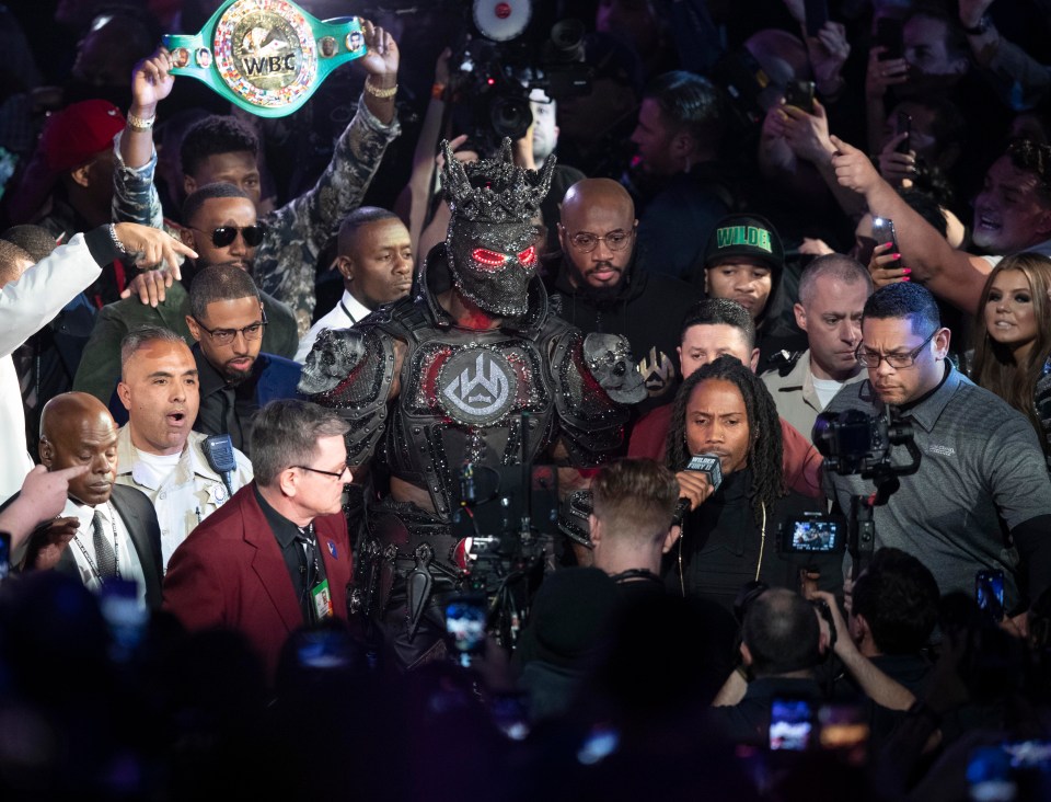 Deontay Wilder walked out to the Tyson Fury fight in a full black costume with face mask and crown