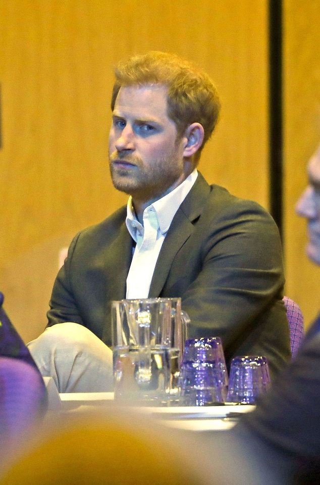  Prince Harry sits in the crowd after delivering his speech