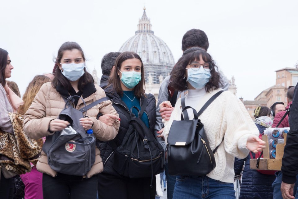  Some of the crowd wore face masks amid a coronavirus outbreak across Italy