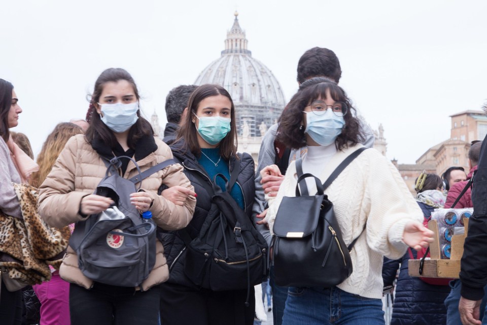 People wear masks to protect themselves from Coronavirus in St. Peter’s Square, Rome