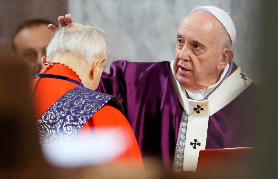  Francis rubs ashes on the head of a cardinal yesterday to celebrate the first day of Lent