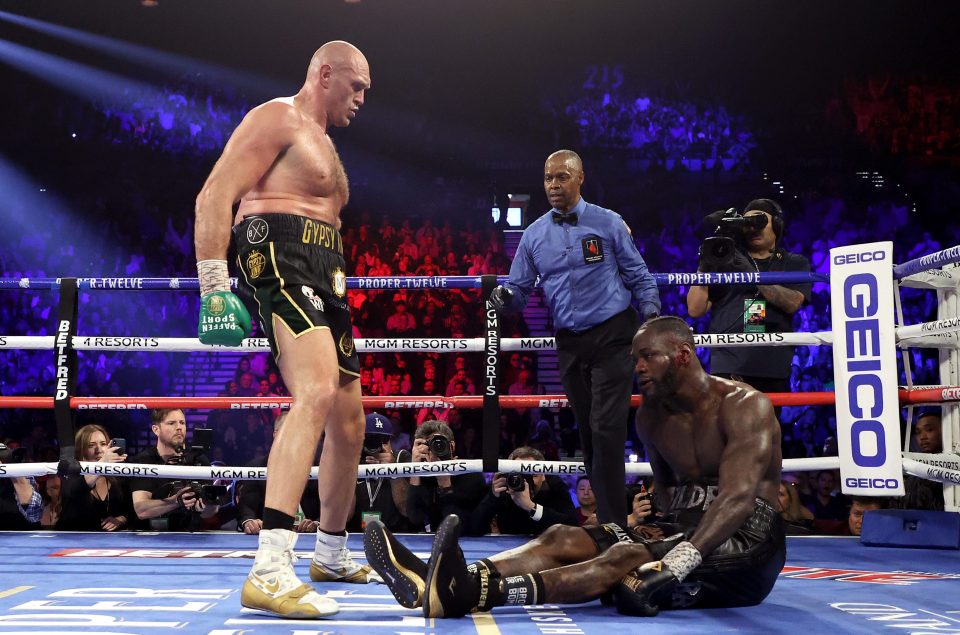 Fury stands over Wilder after dropping the American on a stunning night in Las Vegas