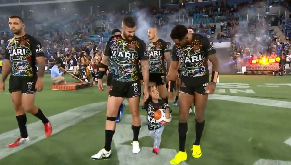  There was a standing ovation for the smiling boy at the rugby league clash in Australia