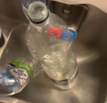 The crew had put two bottles in the sink to use instead of the tap