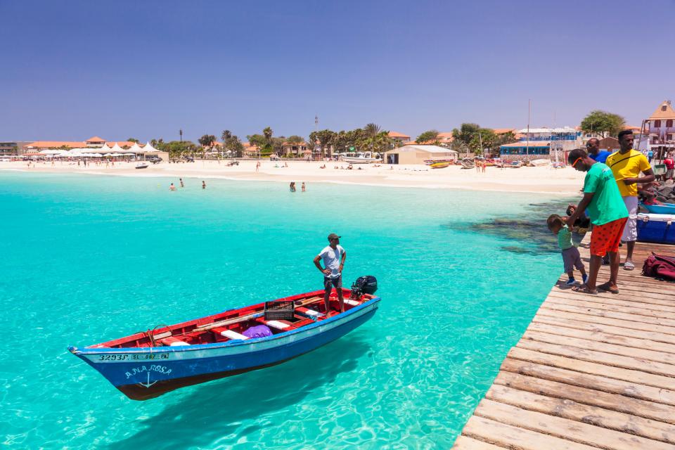  Spend the day beach hopping on a beautiful painted wooden boat