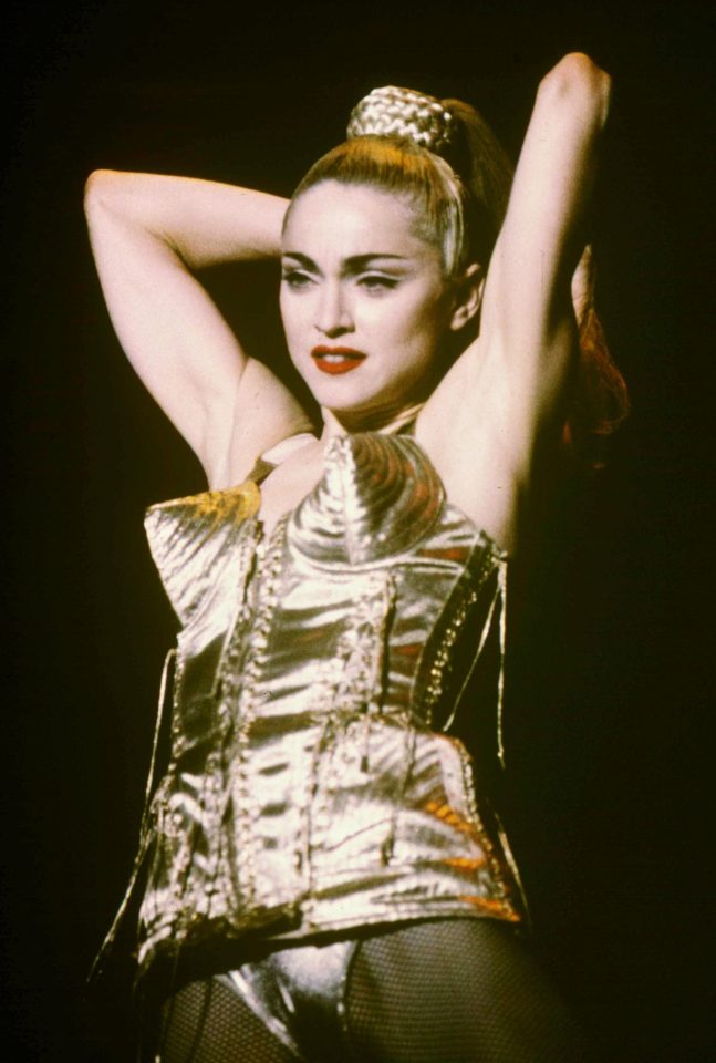  A gold cone bra, red lips and a scraped-back ponytail helped to give Madge a DIY facelift and an even sexier image