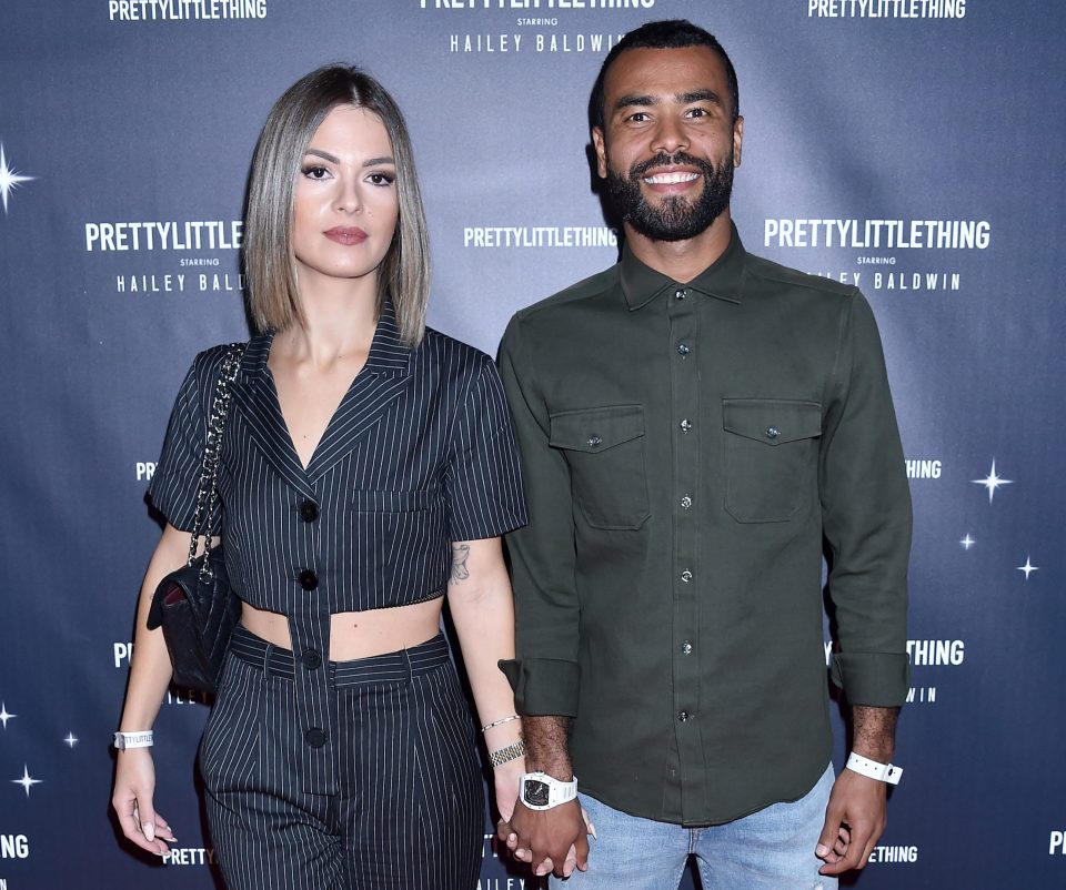  Ashley Cole, pictured with girlfriend Sharon Canu, was attacked by masked robbers