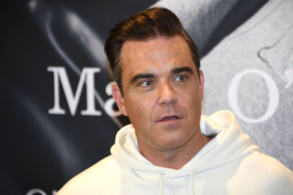  Robbie Williams says he is too old to keep dying his hair after years of covering up his natural greys