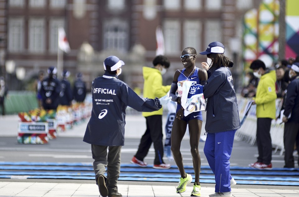 Israeli Lonah Chemtai Salpeter (2nd R) wins the Tokyo Marathon 2020 in Elite Women category as organizers restricted the race due to the Covid-19 outbreak