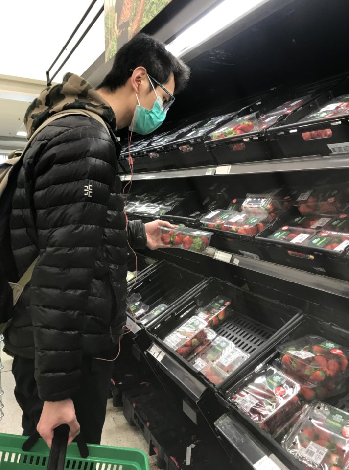  A man wearing a protective face mask shops in an Asda in south London