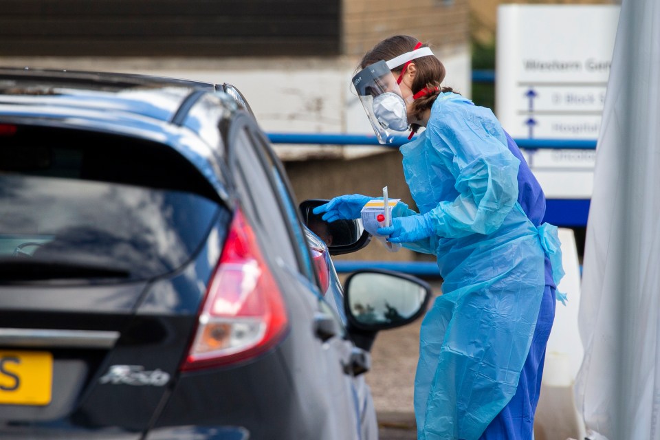  Medical staff swab members of the public in their car at a ‘drive through’ testing facility for Coronavirus at the Western General Hospital in Edinburgh