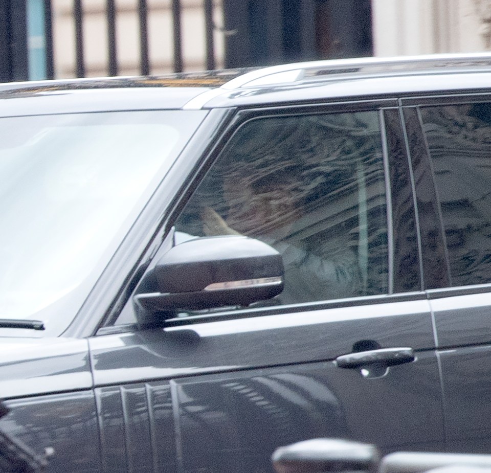  Prince Harry waves as he is spotted leaving Buckingham Palace