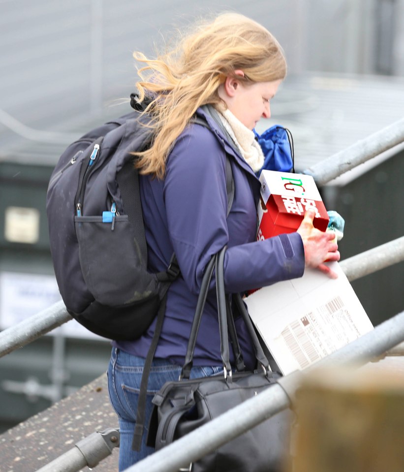  A member of Flybe's staff leaves a meeting at the firm's national HQ in Exeter