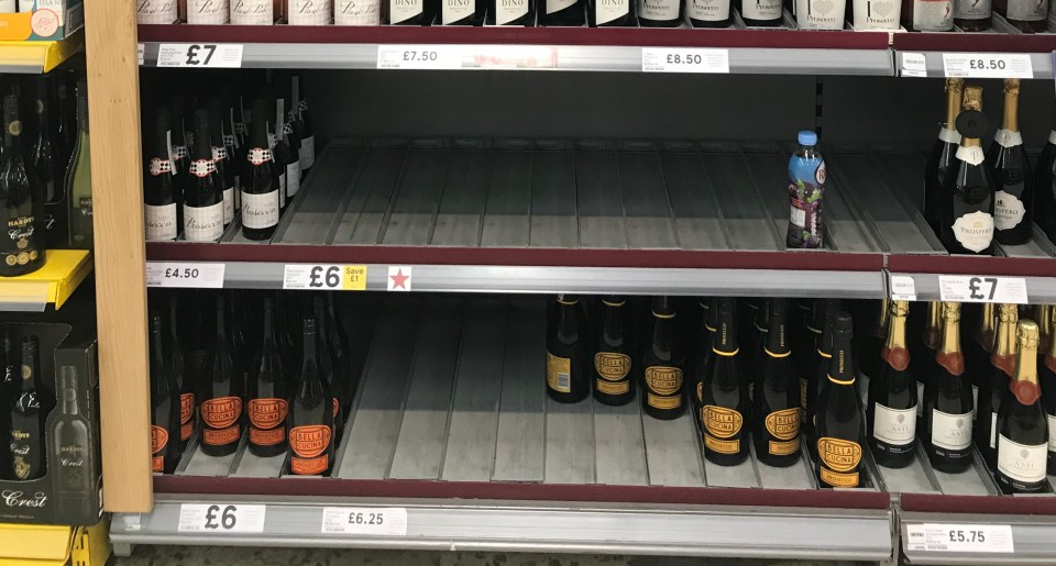  Shelves of the fizz in Tesco in Leatherhead, Surrey, were left completely empty as customers made sure they had enough to last in case of a lockdown