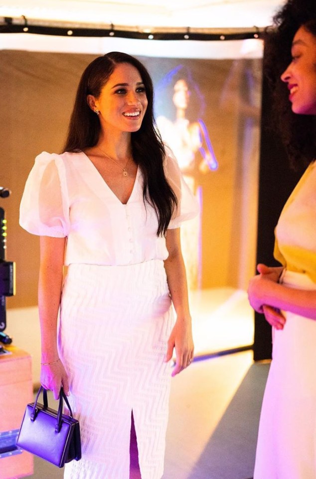  Meghan looked stunning an organza puff-sleeved blouse