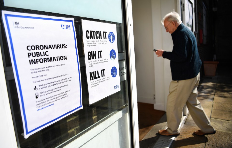  An elderly man enters a coronavirus testing centre in London