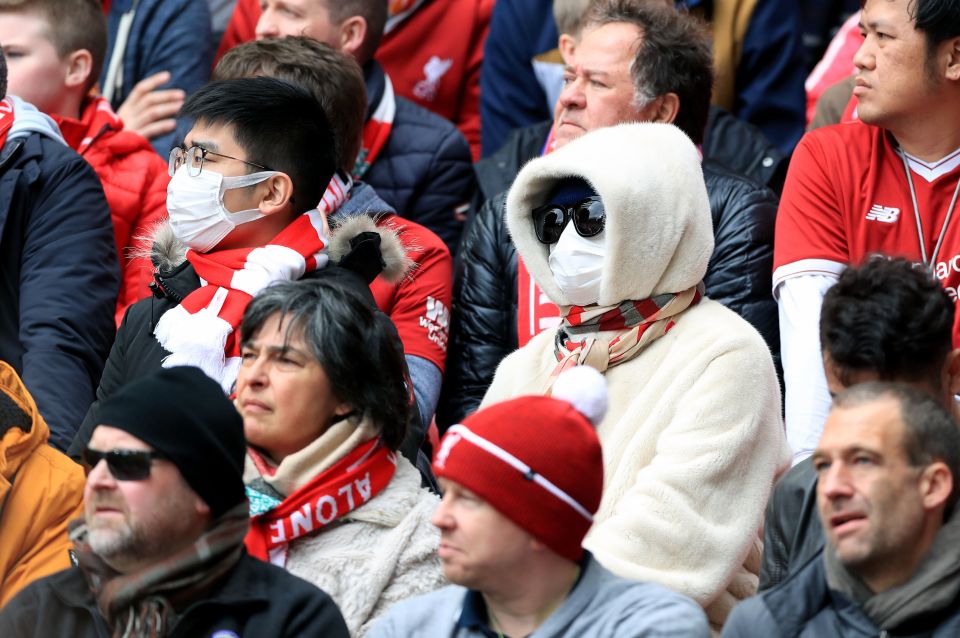  Liverpool fans wearing face masks in the stands during their game against Bournemouth at Anfield today