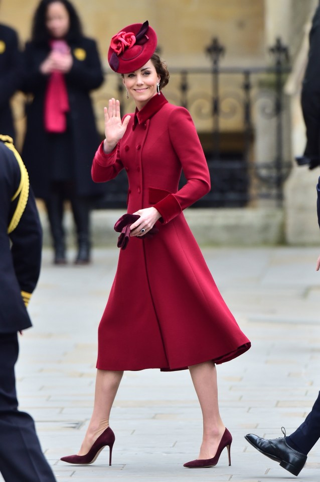 The mum-of-three smiles and waves as she heads inside