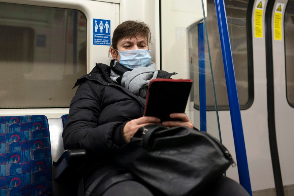  A commuter wears a mask on the London Underground