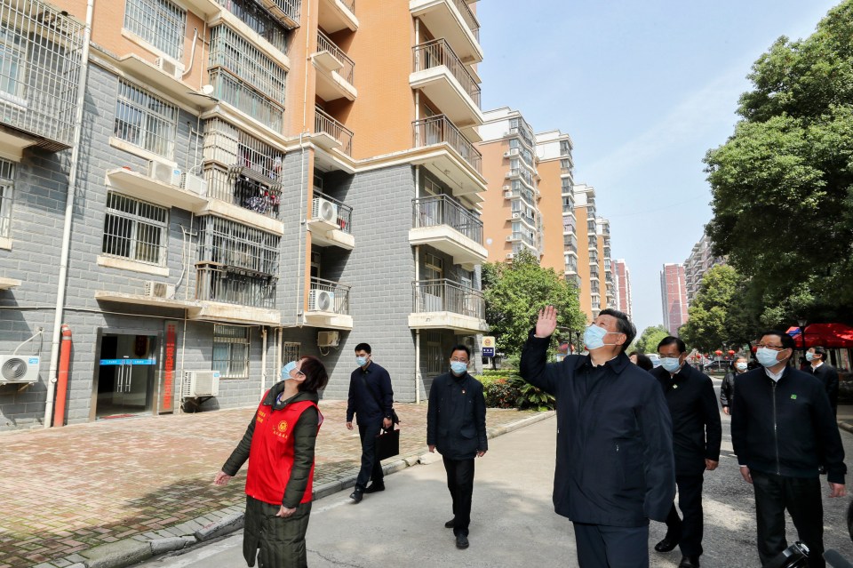 President Xi Jinping waves to residents in quarantine during his visit to Wuhan earlier this month