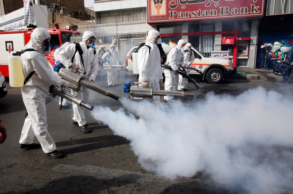 Firefighters disinfect the streets of the Iranian capital last week