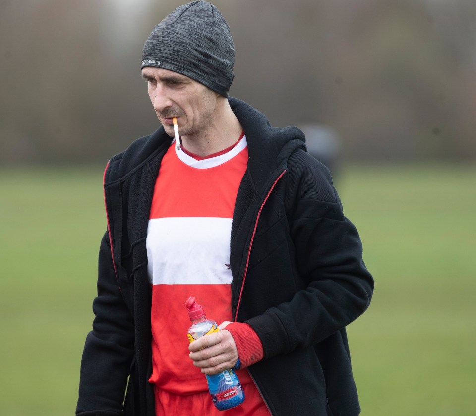 Patryk Reszke sparks up a cigarette during the half-time break