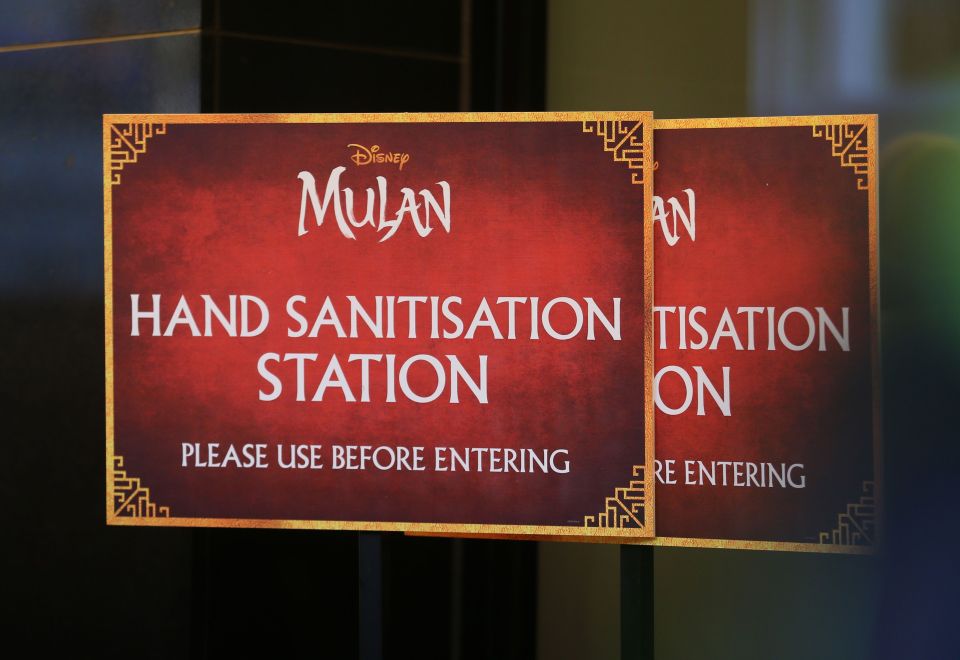 A poster advising cinema goers to use hand sanitisers at a screening of Mulan 