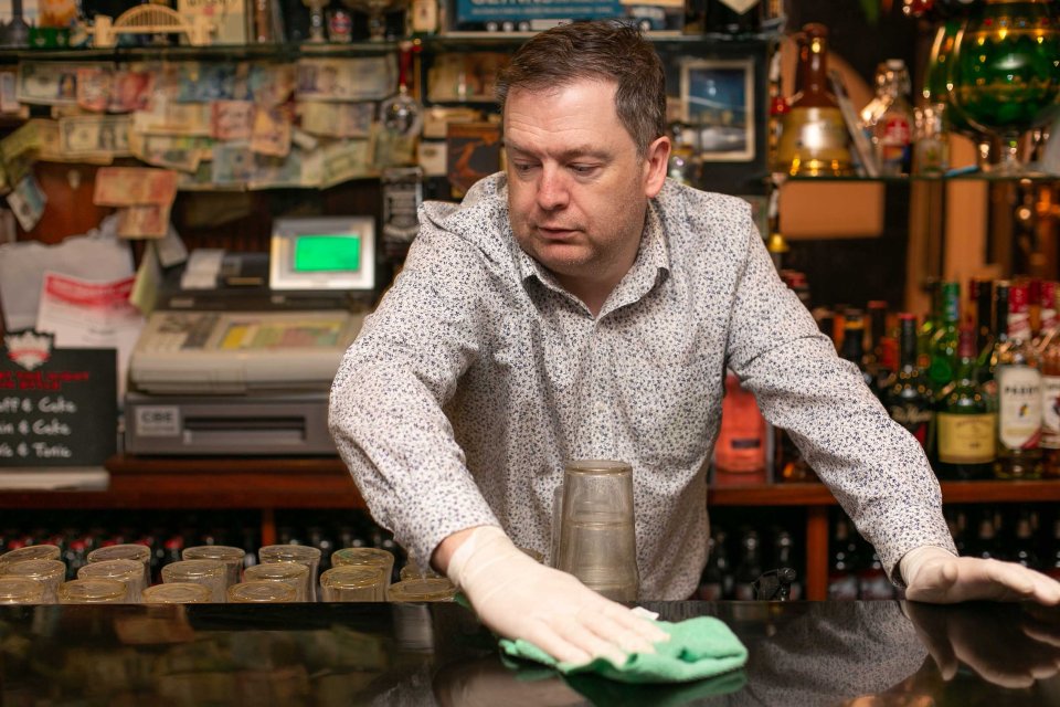  Publican Brian Loftus sitting at the counter of his Pub, Junie's on the Square in Tuam Co. Galway