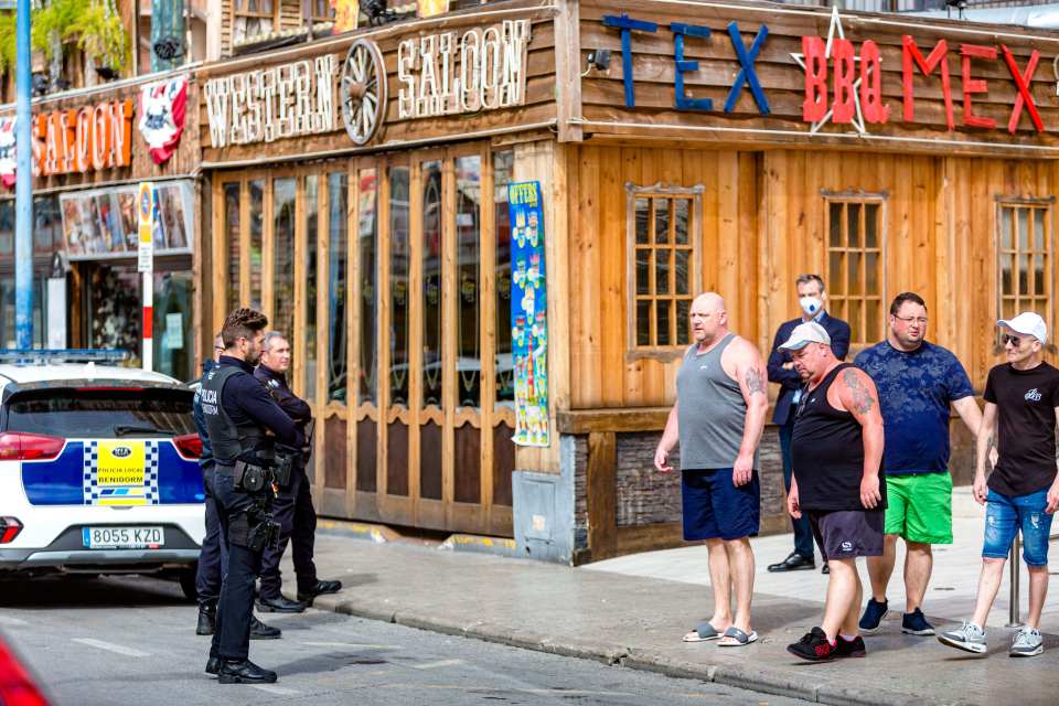  British holidaymakers in Benidorm, who are reportedly ignoring Spain's lockdown, were seen being herded back to their hotels by armed cops today