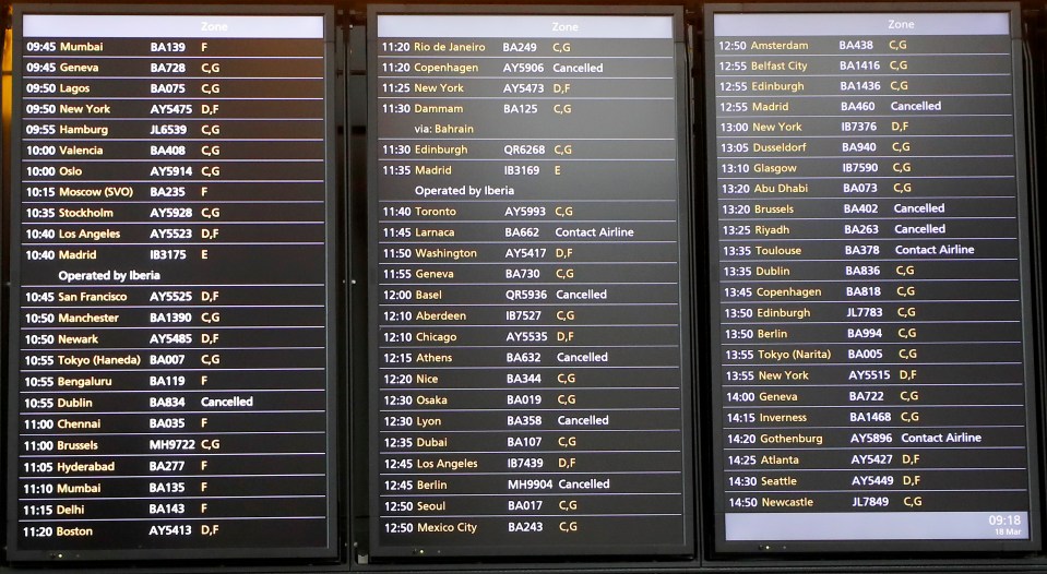  The flight schedule board shows a few cancelled flights at Heathrow Airport in London on Wednesday