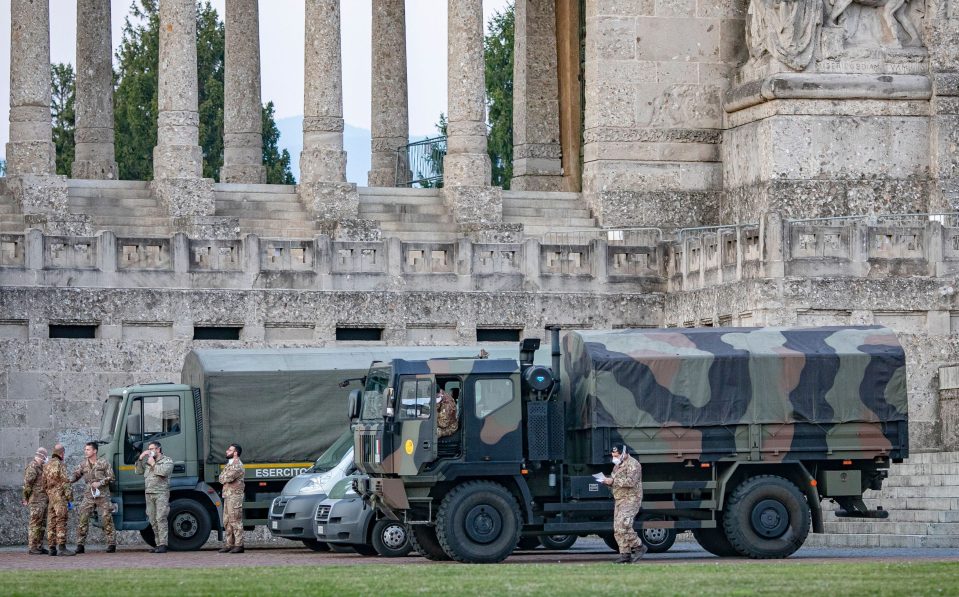 Italian troops outside the central cemetery in Bergamo