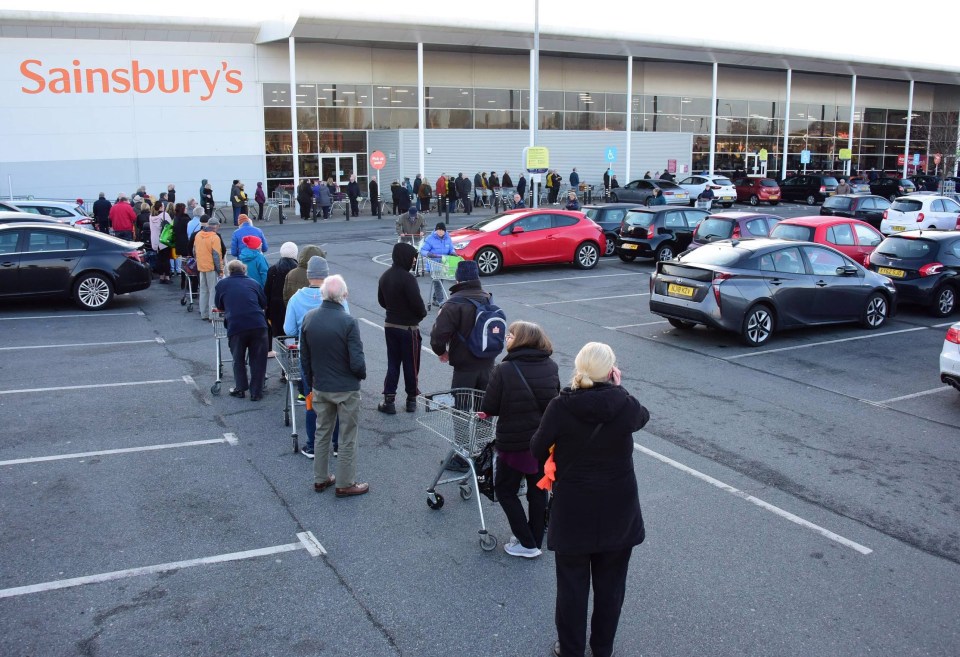 A huge queue forms around the car park at 7am this morning as people line up waiting for the Sainsbury supermarket in Newcastle to open